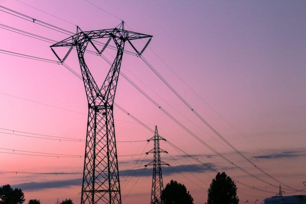 high voltage transmission lines renewable energy grid bottleneck aerial
